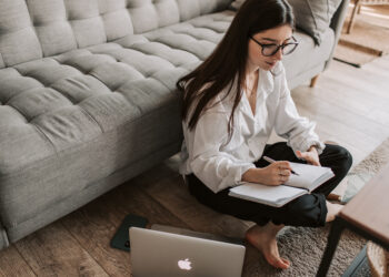 Woman writing on notebook